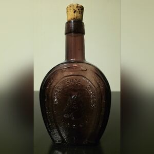 Embossed Purple Horse Shoe Bitters Vintage Glass Bottle